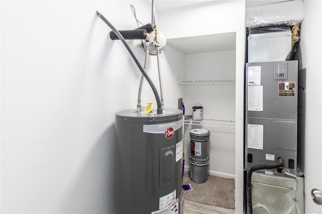utilities featuring electric water heater and heating unit