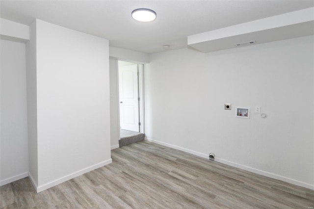 laundry area with hookup for an electric dryer, light wood-type flooring, baseboards, visible vents, and hookup for a washing machine