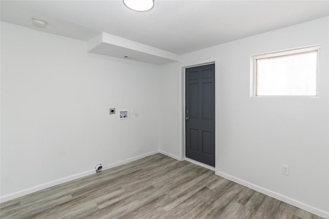 empty room featuring wood finished floors and baseboards