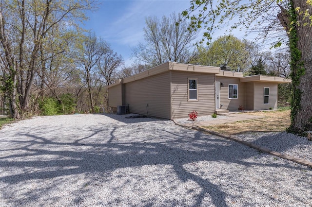 view of property exterior with driveway