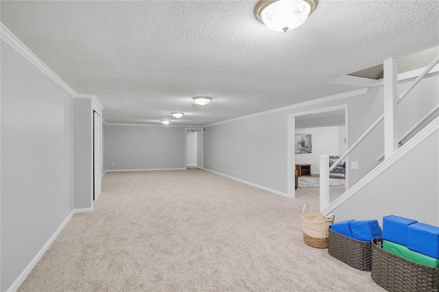 finished basement with crown molding and a textured ceiling