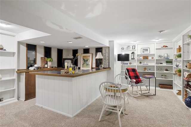 bar featuring bar area, carpet, and visible vents