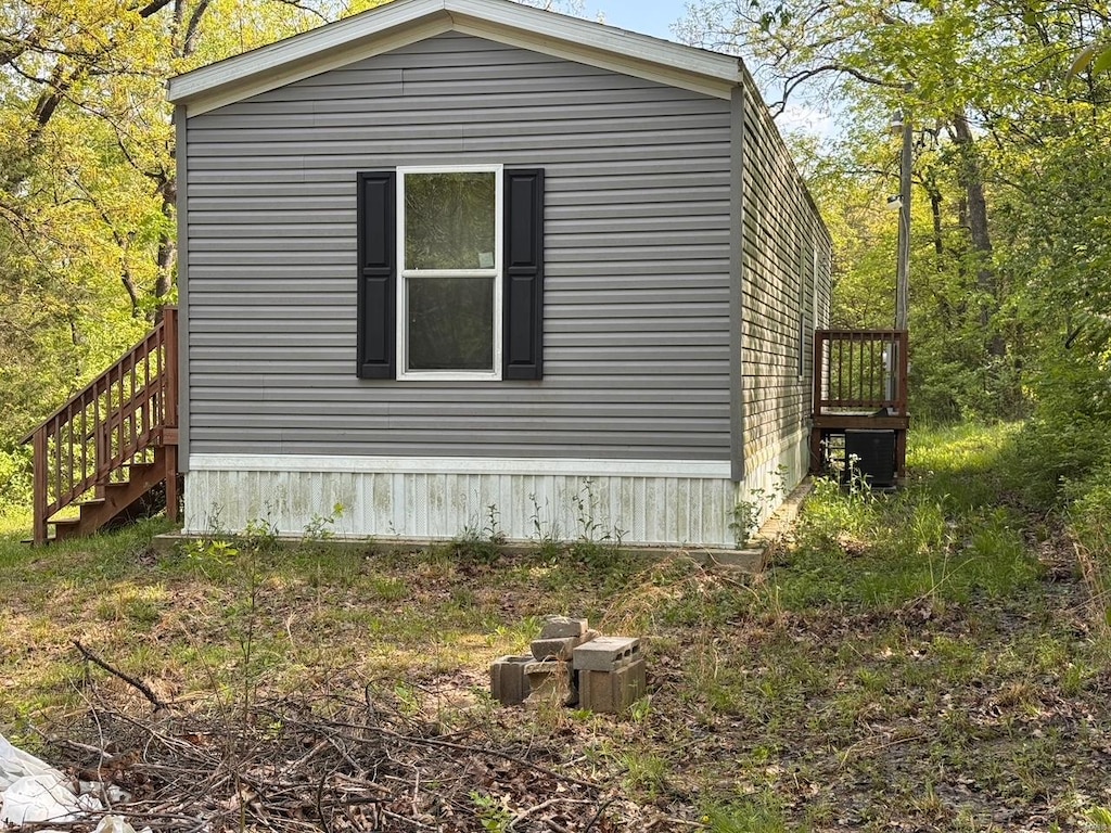 view of home's exterior featuring stairway