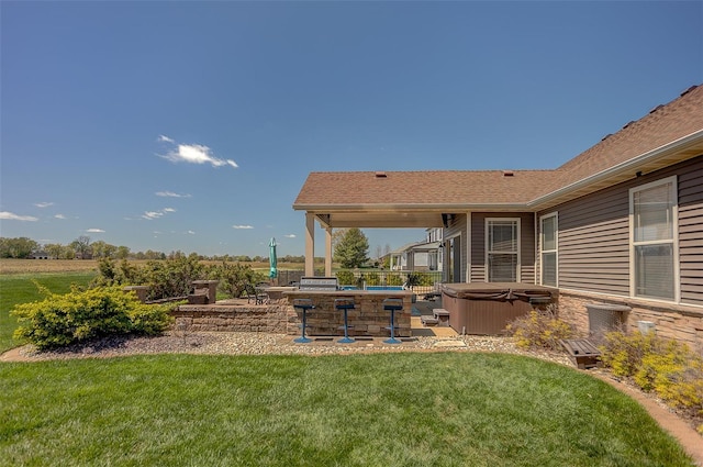 view of yard featuring a hot tub and a patio
