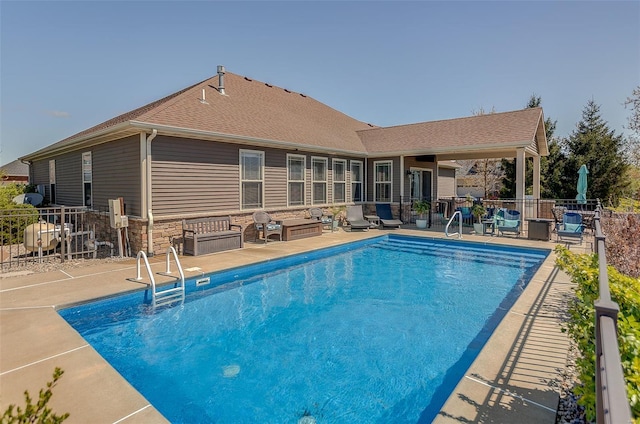 view of pool with a fenced in pool, a patio area, and fence