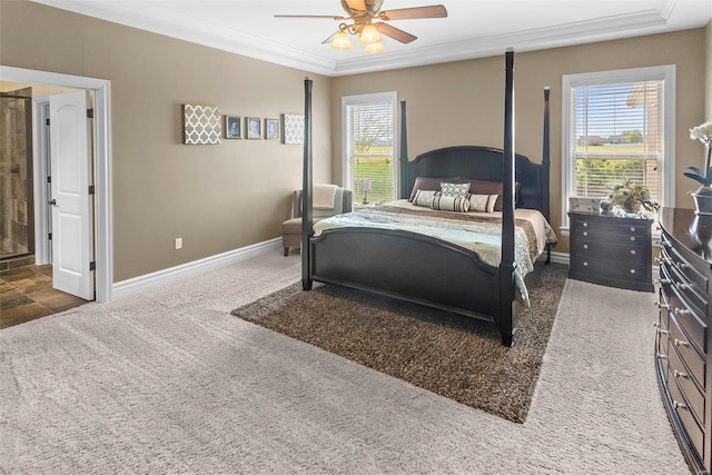 carpeted bedroom featuring ceiling fan, baseboards, and crown molding