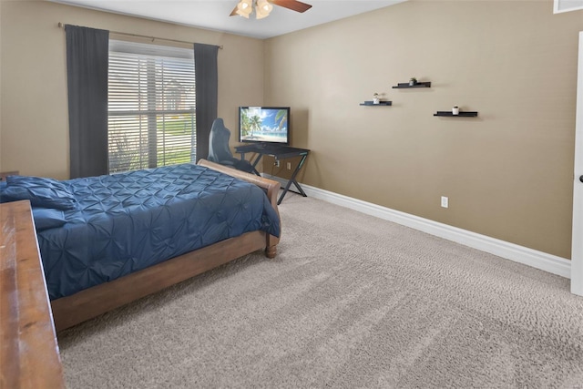 bedroom with carpet floors, visible vents, baseboards, and ceiling fan