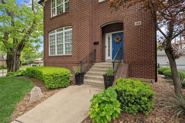 entrance to property with brick siding