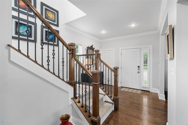 foyer entrance with crown molding, stairs, recessed lighting, baseboards, and wood finished floors