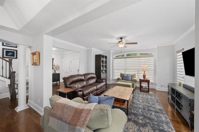 living room featuring decorative columns, baseboards, ceiling fan, stairway, and dark wood finished floors
