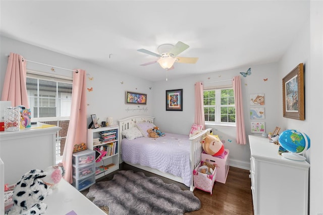 bedroom with baseboards, ceiling fan, and wood finished floors
