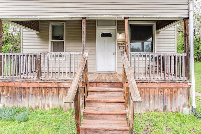 doorway to property featuring covered porch