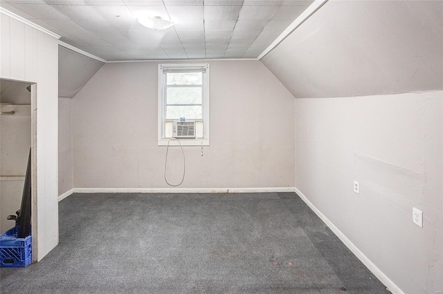 additional living space featuring lofted ceiling, carpet flooring, and baseboards