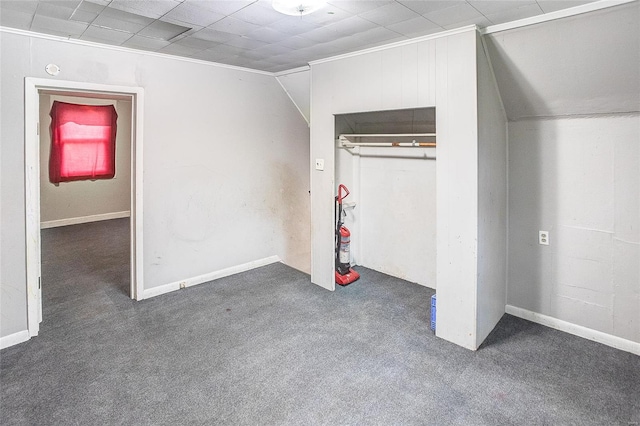 unfurnished bedroom featuring carpet floors, a closet, and ornamental molding