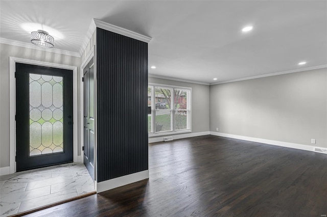 entryway with crown molding, wood finished floors, baseboards, visible vents, and recessed lighting