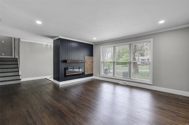 unfurnished living room featuring stairway, wood finished floors, visible vents, ornamental molding, and baseboards