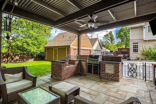 view of patio / terrace featuring fence, a ceiling fan, grilling area, and area for grilling
