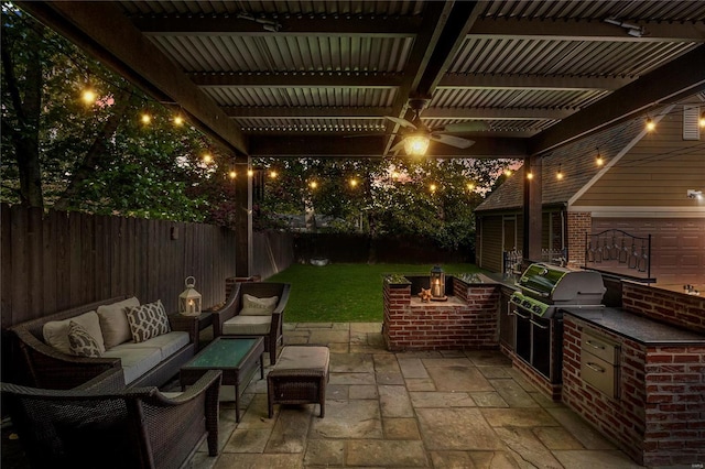 view of patio / terrace featuring outdoor lounge area, a pergola, a fenced backyard, a ceiling fan, and exterior kitchen