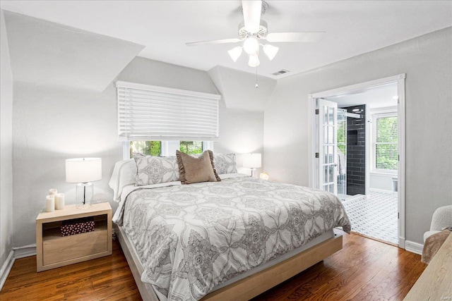 bedroom featuring baseboards, access to exterior, wood finished floors, and visible vents