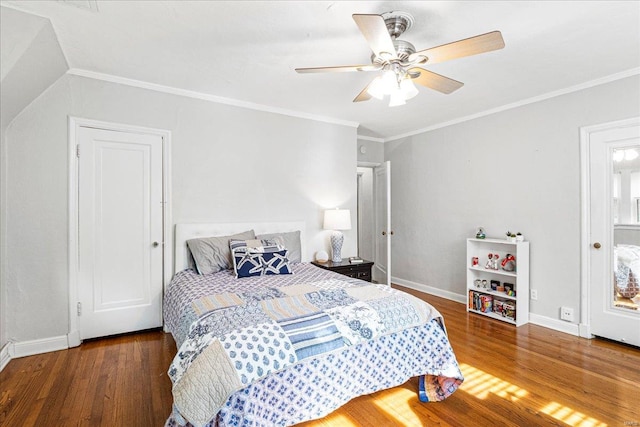 bedroom featuring baseboards, ornamental molding, and wood finished floors