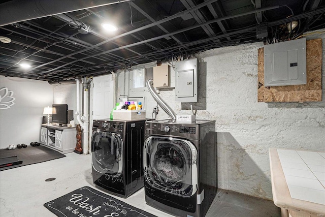 laundry area with separate washer and dryer, electric panel, and laundry area