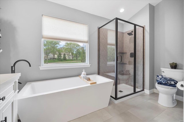 full bathroom featuring a soaking tub, a stall shower, toilet, and tile patterned flooring