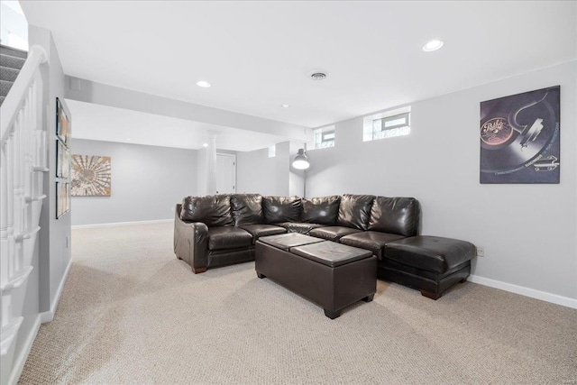 living room featuring visible vents, baseboards, recessed lighting, and light carpet