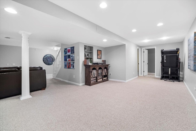 finished below grade area featuring recessed lighting, stairway, light colored carpet, and baseboards