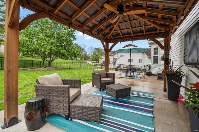 view of patio with a gazebo, outdoor lounge area, and a fenced backyard