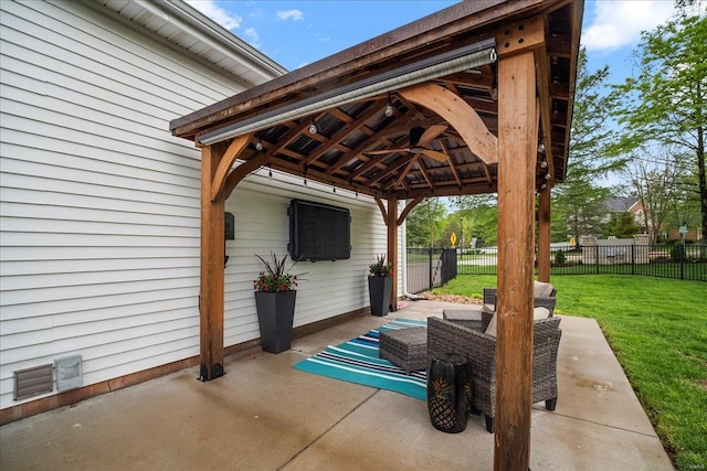 view of patio / terrace with fence and a gazebo