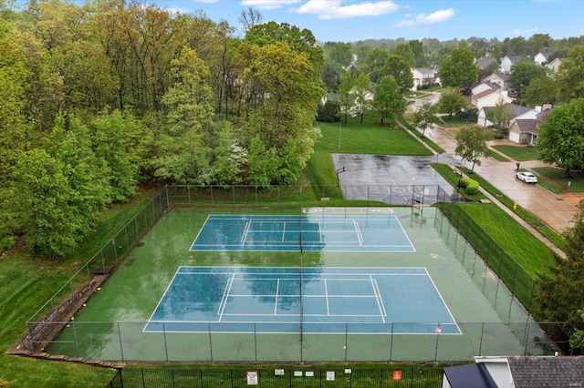 view of sport court with fence
