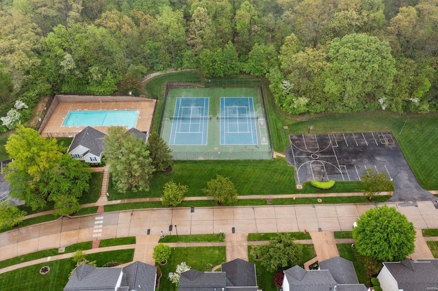 drone / aerial view featuring a view of trees