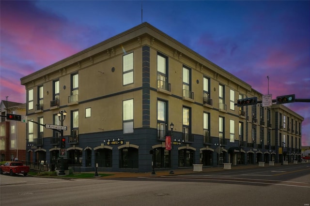 view of property at dusk