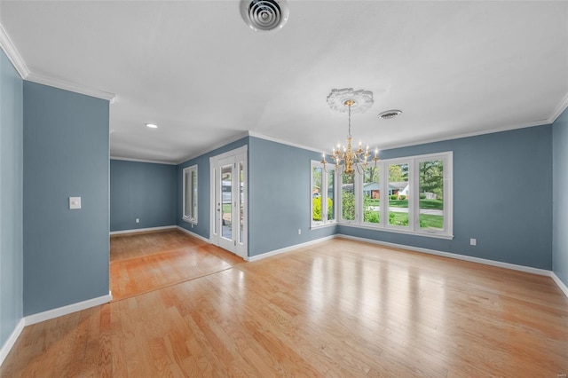 interior space featuring a wealth of natural light, an inviting chandelier, and crown molding