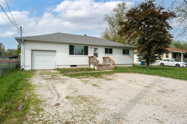 single story home with fence, driveway, and a garage