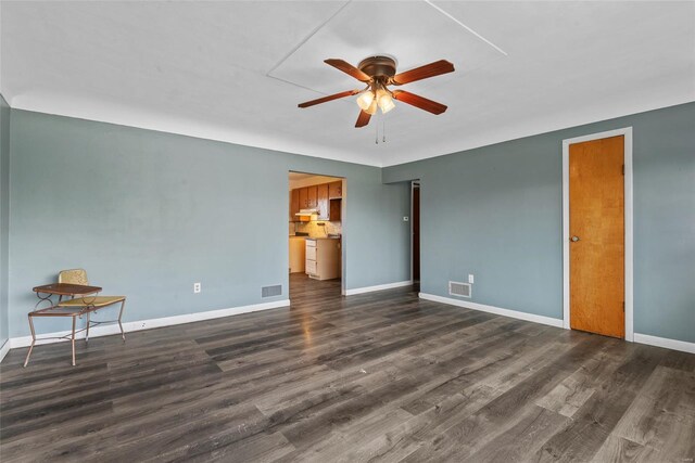 unfurnished bedroom featuring baseboards, wood finished floors, visible vents, and ceiling fan