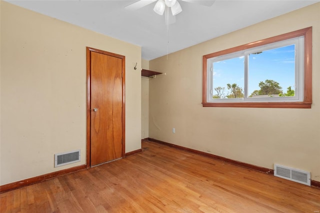 unfurnished bedroom with light wood-type flooring, baseboards, and visible vents