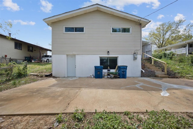 back of house featuring fence and a patio