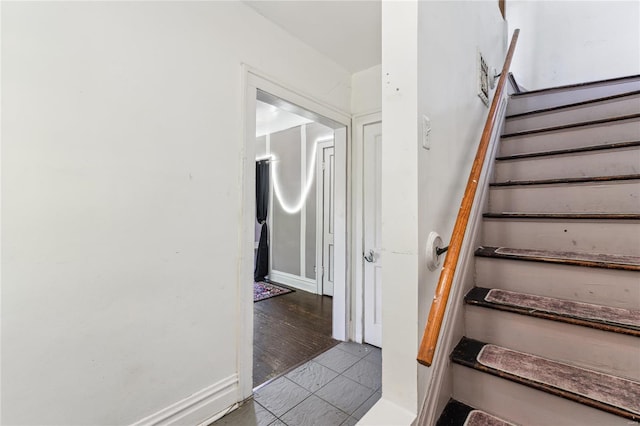 staircase with tile patterned floors