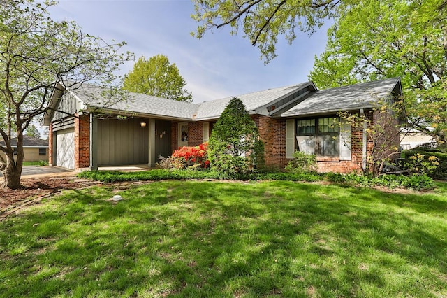 ranch-style house featuring a front lawn, brick siding, and a garage