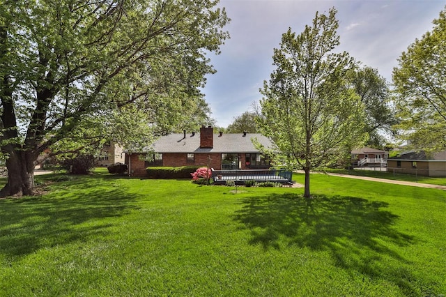 view of yard featuring a wooden deck