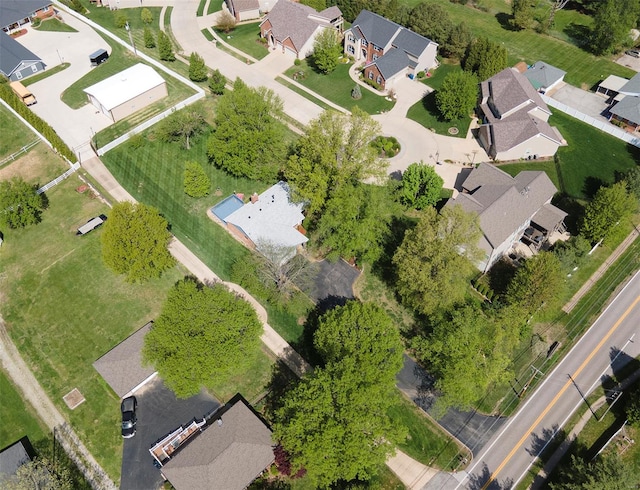 birds eye view of property with a residential view
