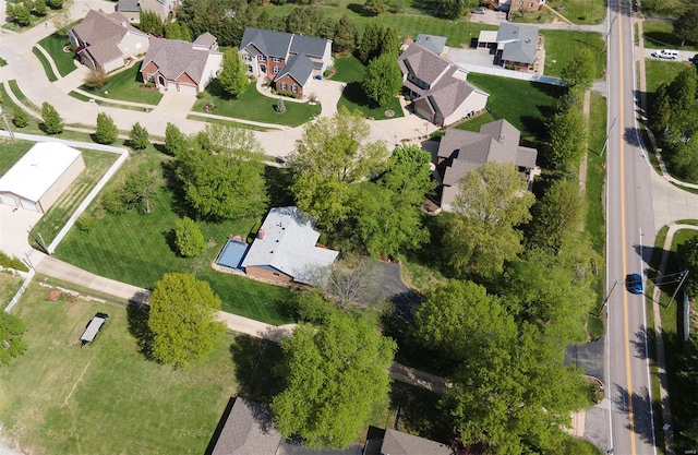 birds eye view of property with a residential view