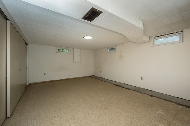 below grade area featuring electric panel and visible vents