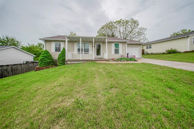 ranch-style house featuring a garage, fence, covered porch, a front yard, and concrete driveway