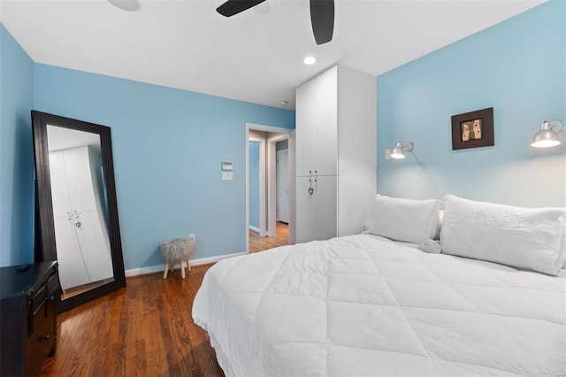 bedroom featuring baseboards, recessed lighting, a ceiling fan, and wood finished floors