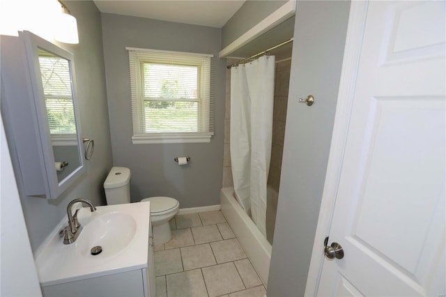 bathroom featuring vanity, toilet, shower / bath combo, and tile patterned floors