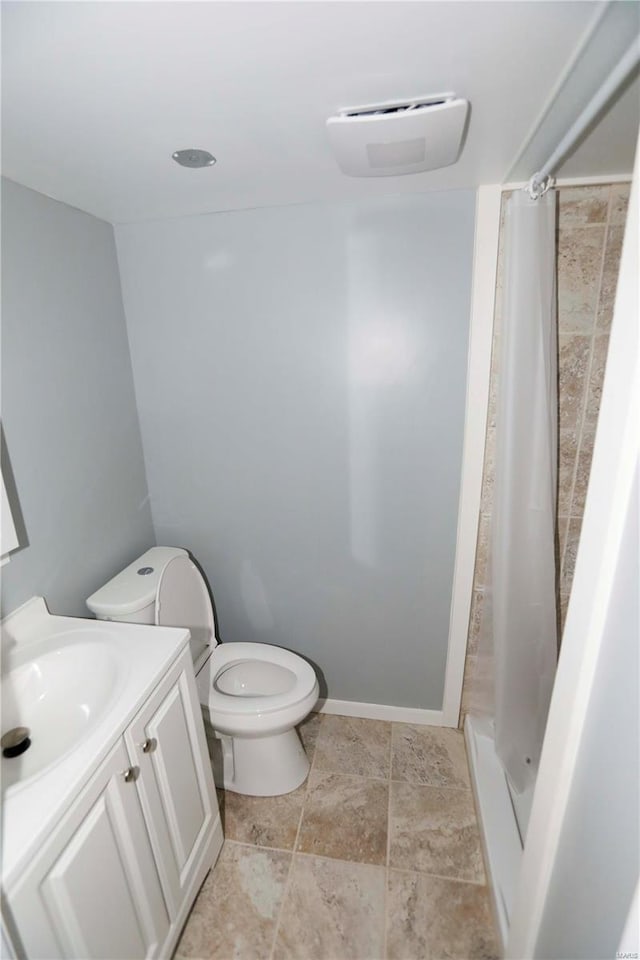 bathroom with vanity, toilet, and a shower with curtain