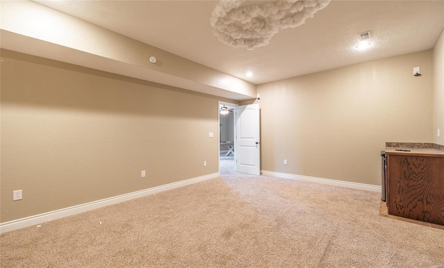 interior space featuring baseboards and carpet