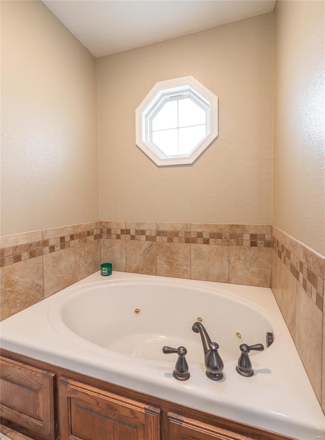 full bath with a jetted tub